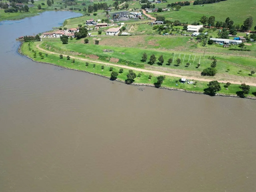 Long aerial view of fishing stands along the water